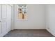 A bright bedroom features neutral carpet and a window at 5094 E Umber Rd, San Tan Valley, AZ 85143