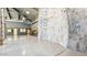 Bright community center's indoor climbing wall with concrete base and fixtures at 5094 E Umber Rd, San Tan Valley, AZ 85143