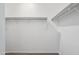 Bright closet with carpet and closet rods offers ample storage space at 5094 E Umber Rd, San Tan Valley, AZ 85143