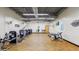 Community gym featuring weight machines, benches, and open space, offering a variety of workout options at 5094 E Umber Rd, San Tan Valley, AZ 85143