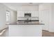 Bright kitchen featuring granite countertops, stainless appliances, and white cabinets at 5094 E Umber Rd, San Tan Valley, AZ 85143