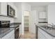 Kitchen featuring stainless steel appliances and a spacious pantry with shelves at 5094 E Umber Rd, San Tan Valley, AZ 85143