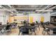 Community lounge with tables, chairs, and kitchenette, creating a comfortable gathering space at 5094 E Umber Rd, San Tan Valley, AZ 85143