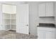 Pantry with shelves, providing ample storage space next to the kitchen at 5094 E Umber Rd, San Tan Valley, AZ 85143