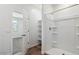 Bright bathroom showcasing a tiled shower with a glass door, and an open closet at 5865 E Axle Ln, San Tan Valley, AZ 85140