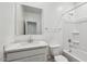 Clean and bright bathroom with a modern vanity, sink, toilet, and a bathtub with shower at 5865 E Axle Ln, San Tan Valley, AZ 85140