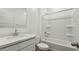 Bright bathroom featuring a tub with shower, white cabinets, and a modern sink at 5865 E Axle Ln, San Tan Valley, AZ 85140