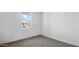 This bedroom has a large window letting in natural light and is carpeted at 5865 E Axle Ln, San Tan Valley, AZ 85140