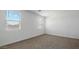 Neutral bedroom with carpeted floors and two windows offering natural light at 5865 E Axle Ln, San Tan Valley, AZ 85140