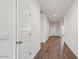 Clean, well-lit hallway with modern tile floors connecting various rooms in the house at 5865 E Axle Ln, San Tan Valley, AZ 85140