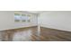 Spacious living room with tile flooring and abundant natural light from large windows at 5865 E Axle Ln, San Tan Valley, AZ 85140