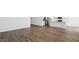 Expansive living room featuring sleek, wood-look tile flooring and open-concept design at 5865 E Axle Ln, San Tan Valley, AZ 85140