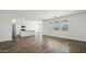 Bright, open-concept living room featuring tile floors and views of the kitchen at 5865 E Axle Ln, San Tan Valley, AZ 85140