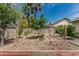 Backyard featuring a fenced garden area with raised garden beds and palm trees at 620 N Entrada St, Chandler, AZ 85226