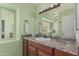 Bathroom featuring a single sink vanity with granite countertop and large mirror at 620 N Entrada St, Chandler, AZ 85226
