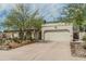 Charming home with a two-car garage, desert landscaping, and a well-maintained front yard at 620 N Entrada St, Chandler, AZ 85226