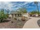 Beautifully landscaped front yard with desert plants, rocks, and a well-maintained lawn, enhancing curb appeal at 620 N Entrada St, Chandler, AZ 85226