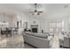 Open living room with bar seating, tile floors, and fireplace for a cozy atmosphere at 620 N Entrada St, Chandler, AZ 85226