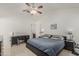 Well-lit bedroom features tile flooring, ceiling fan, and neutral colored walls at 620 N Entrada St, Chandler, AZ 85226