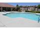 Community pool with lounge chairs and clear, refreshing water for residents to enjoy on a sunny day at 620 N Entrada St, Chandler, AZ 85226