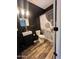 Modern bathroom features a stylish sink, toilet, vanity and hardwood style floors at 6808 W Maldonado Rd, Laveen, AZ 85339