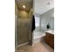 Bathroom featuring a shower, tub, and vanity with modern fixtures and finishes at 6808 W Maldonado Rd, Laveen, AZ 85339