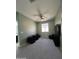 Cozy bedroom with a fan and large window for natural light at 6808 W Maldonado Rd, Laveen, AZ 85339