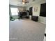 Bedroom with bunk bed, gray carpet, ceiling fan, and plenty of space at 6808 W Maldonado Rd, Laveen, AZ 85339