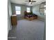 Bedroom with a wooden bed frame with drawers and shelves along the headboard at 6808 W Maldonado Rd, Laveen, AZ 85339