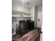 Convenient laundry room with modern washer and dryer, and plenty of storage shelving at 6808 W Maldonado Rd, Laveen, AZ 85339