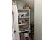 Organized pantry with shelving for ample food and storage in the kitchen at 6808 W Maldonado Rd, Laveen, AZ 85339