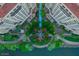 Bird's eye view of luxury condos with symmetrical garden, lush landscaping and a calm waterway at 7175 E Camelback Rd # 902, Scottsdale, AZ 85251