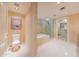 A modern bathroom featuring a toilet, tub, shower, walk-in closet and artistic decor creates a soothing and functional space at 7175 E Camelback Rd # 902, Scottsdale, AZ 85251