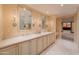 A luxurious bathroom showcases double vanities, marble countertops, and decorative lighting, creating a spa-like retreat at 7175 E Camelback Rd # 902, Scottsdale, AZ 85251