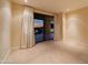 A spacious bedroom offers a serene retreat with an exterior balcony and stunning views of the landscape at 7175 E Camelback Rd # 902, Scottsdale, AZ 85251