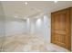 Versatile bonus room showcasing travertine flooring and recessed lighting at 7175 E Camelback Rd # 902, Scottsdale, AZ 85251