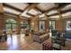 Relaxing lounge area with wood floors, a cozy sofa, and ample seating at 7175 E Camelback Rd # 902, Scottsdale, AZ 85251