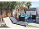 A beautiful backyard provides a relaxing seating area and lounge chairs for outdoor living at 7635 E Verde Ln, Scottsdale, AZ 85251