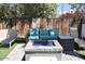 Inviting backyard featuring a cozy fire pit area with stylish seating and lush greenery at 7635 E Verde Ln, Scottsdale, AZ 85251