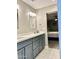 Stylish bathroom featuring gray cabinets, double sinks, and an elegant vanity with modern fixtures at 7635 E Verde Ln, Scottsdale, AZ 85251