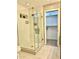 Modern bathroom with a glass-enclosed shower and a convenient storage closet at 7635 E Verde Ln, Scottsdale, AZ 85251