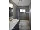 Modern bathroom featuring a stylish vanity, tiled walls, and a shower-tub combination with contemporary fixtures at 7635 E Verde Ln, Scottsdale, AZ 85251