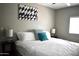 Comfortable bedroom featuring a large bed, stylish decor, and plenty of natural light at 7635 E Verde Ln, Scottsdale, AZ 85251
