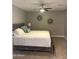 Cozy bedroom featuring a ceiling fan, neutral walls, and comfortable furnishings for a relaxing space at 7635 E Verde Ln, Scottsdale, AZ 85251
