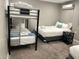 Versatile bedroom with a bunk bed, a double bed, and soft carpeting at 7635 E Verde Ln, Scottsdale, AZ 85251