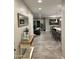 Open-concept design with tile floors, flowing into the living room and kitchen areas at 7635 E Verde Ln, Scottsdale, AZ 85251