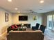 Spacious living room with a ceiling fan, modern decor, and a sliding door to the patio at 7635 E Verde Ln, Scottsdale, AZ 85251