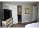 Spacious main bedroom showing a modern interior design with a sliding door to the main bathroom at 7635 E Verde Ln, Scottsdale, AZ 85251