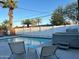 A serene pool area features comfortable lounge chairs perfect for relaxation in the sun at 7635 E Verde Ln, Scottsdale, AZ 85251