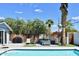 Refreshing backyard pool with lounge area, lush greenery, and a privacy fence perfect for outdoor entertaining at 7635 E Verde Ln, Scottsdale, AZ 85251